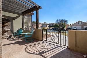 Gate featuring a residential view and a pergola