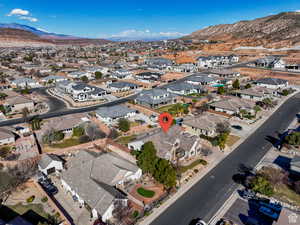 Aerial overview of property's location featuring mountains and nearby suburban area