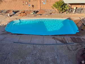 View of swimming pool with a patio area