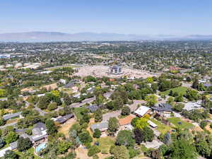 Aerial view of property's location featuring nearby suburban area and a mountain backdrop