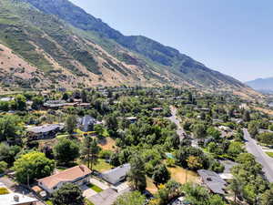 Aerial perspective of suburban area featuring a mountainous background