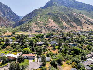 Aerial perspective of suburban area with a mountain backdrop