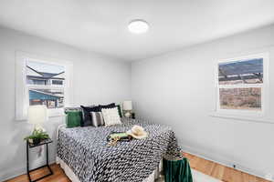 Bedroom featuring light wood-style floors and baseboards
