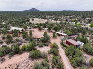 Aerial view of sparsely populated area featuring a mountainous background