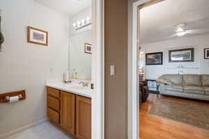 Bathroom with vanity and ceiling fan