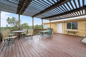 Wooden terrace featuring outdoor dining space