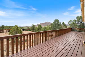 Wooden deck featuring a mountain view