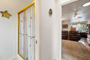 Corridor featuring baseboards