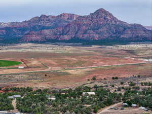 View of mountain backdrop with rural landscape