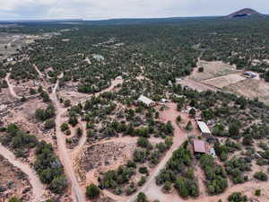 Aerial view of property and surrounding area featuring rural landscape and a desert landscape
