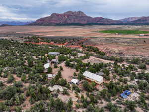 Overview of rural landscape with a mountainous background and a desert landscape