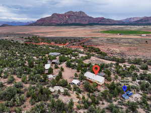 Overview of rural landscape featuring a mountain backdrop