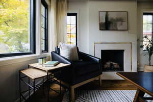 Living area featuring a fireplace and wood finished floors