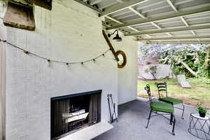 View of patio / terrace with exterior fireplace