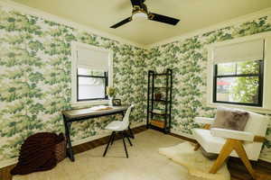 Office space featuring ornamental molding, healthy amount of natural light, and wood finished floors