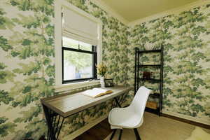 Office featuring wood finished floors, crown molding, and wallpapered walls