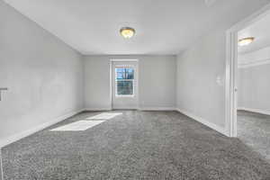 Spare room with light carpet