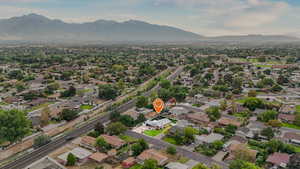 Aerial view of residential area featuring mountains