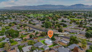 View of property location with nearby suburban area and a mountainous background