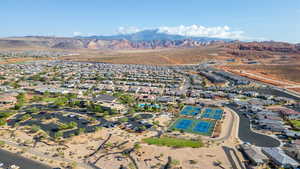 Aerial overview of property's location featuring nearby suburban area and a mountain backdrop