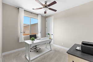 Office featuring light carpet and a ceiling fan