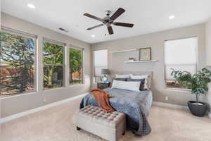 Bedroom featuring carpet flooring, a ceiling fan, and recessed lighting