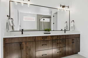 Full bath featuring double vanity, a shower stall, light tile patterned flooring, and recessed lighting