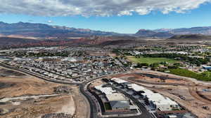 View of property location with a mountainous background and nearby suburban area