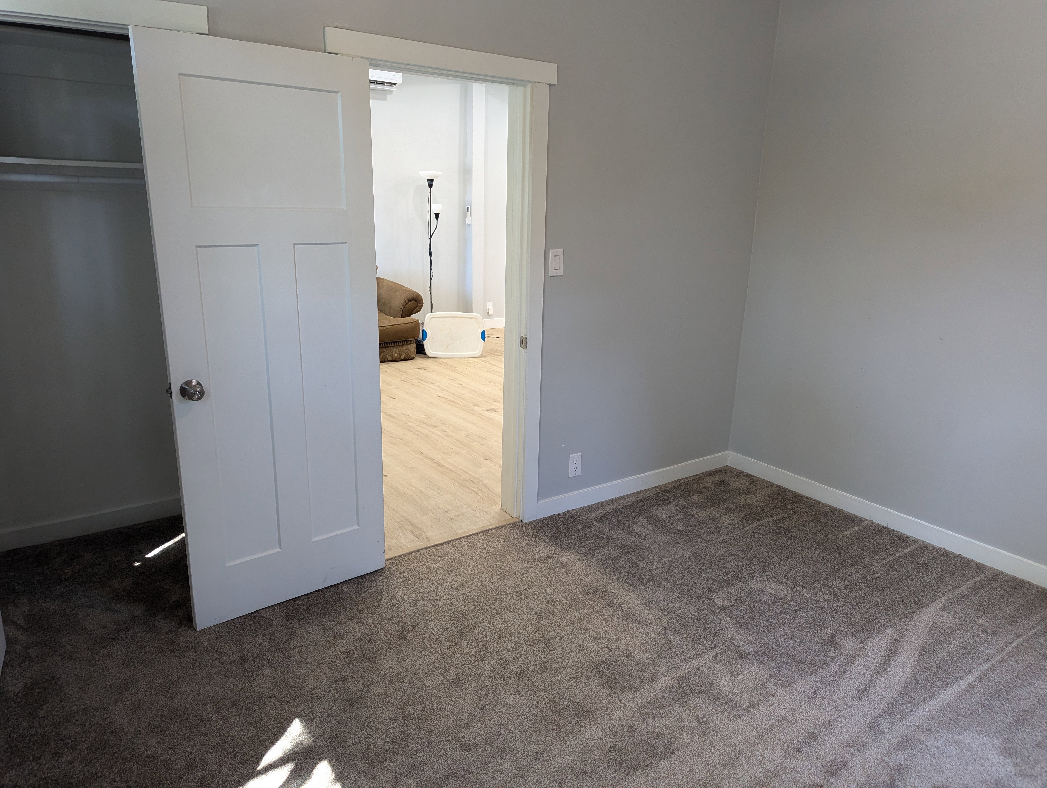 Unfurnished bedroom with carpet and baseboards