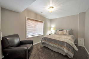 Carpeted bedroom with baseboards