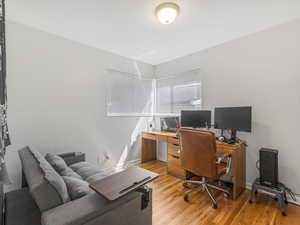 Bedroom #2 with light wood finished floors