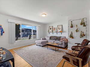 Living room with light wood-style floors and baseboards