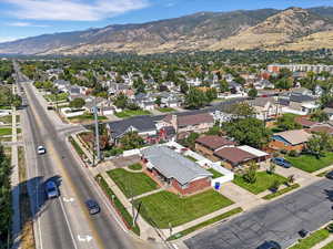 Aerial perspective of suburban area featuring a mountain backdrop