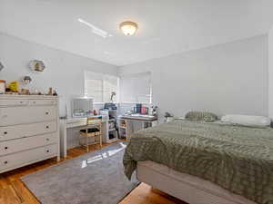 Bedroom #1 with light wood-style flooring