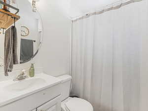 Full bathroom with vanity and a shower/tub combo