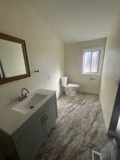 Bathroom with vanity and light marble finish flooring