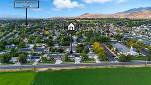 Aerial view of residential area featuring a mountain backdrop