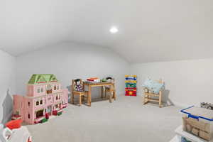 Recreation room with carpet floors, vaulted ceiling, and recessed lighting. Connects to bedroom 3&4
