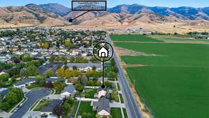 Aerial view of residential area featuring a mountainous background
