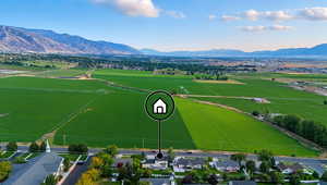 Aerial view of residential area featuring mountains