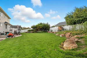View of fenced backyard