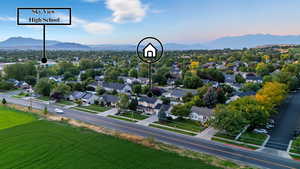 Aerial view of residential area featuring a mountain backdrop