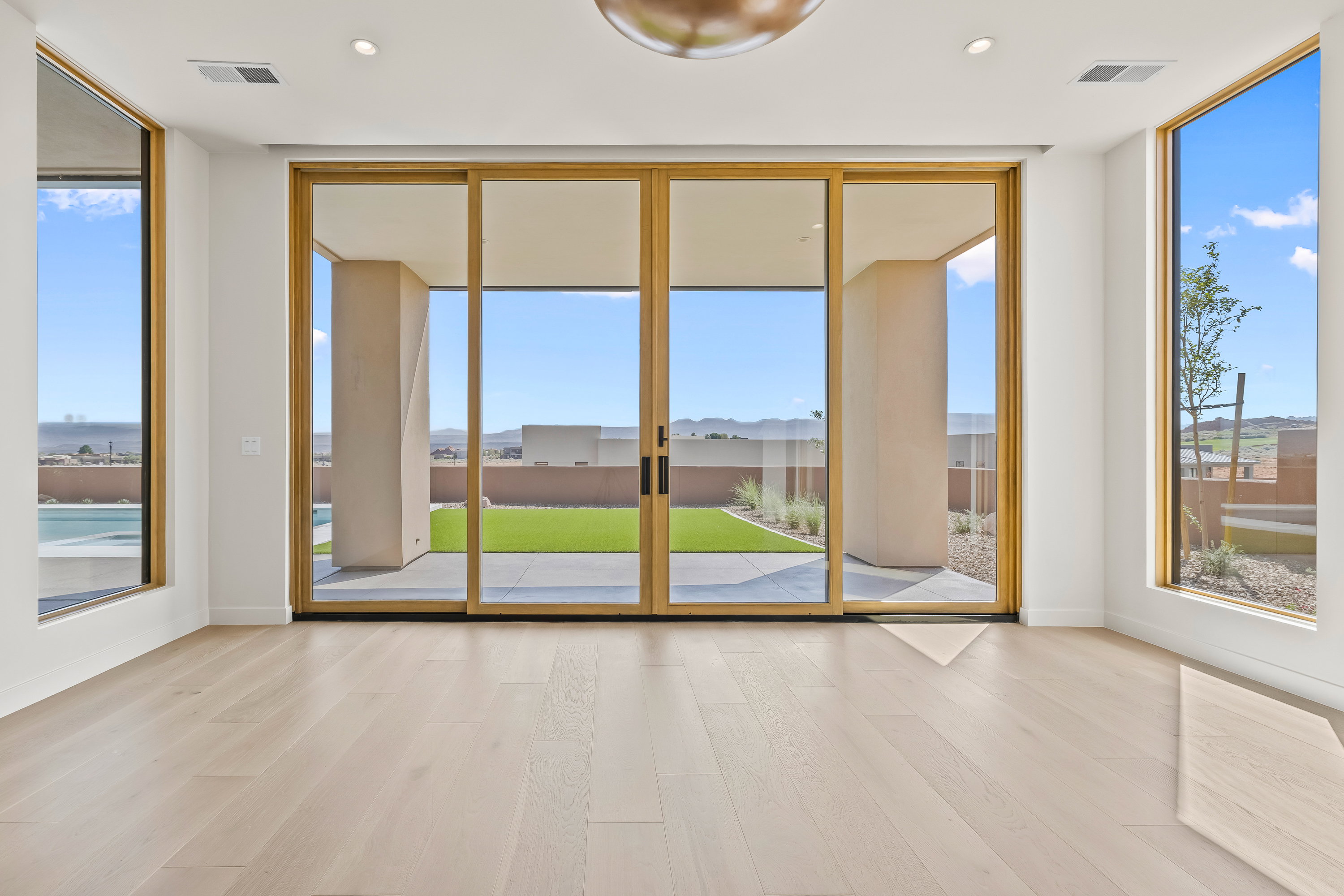 Large Primary Bedroom with a Large Slider and Windows to Capture all the Views