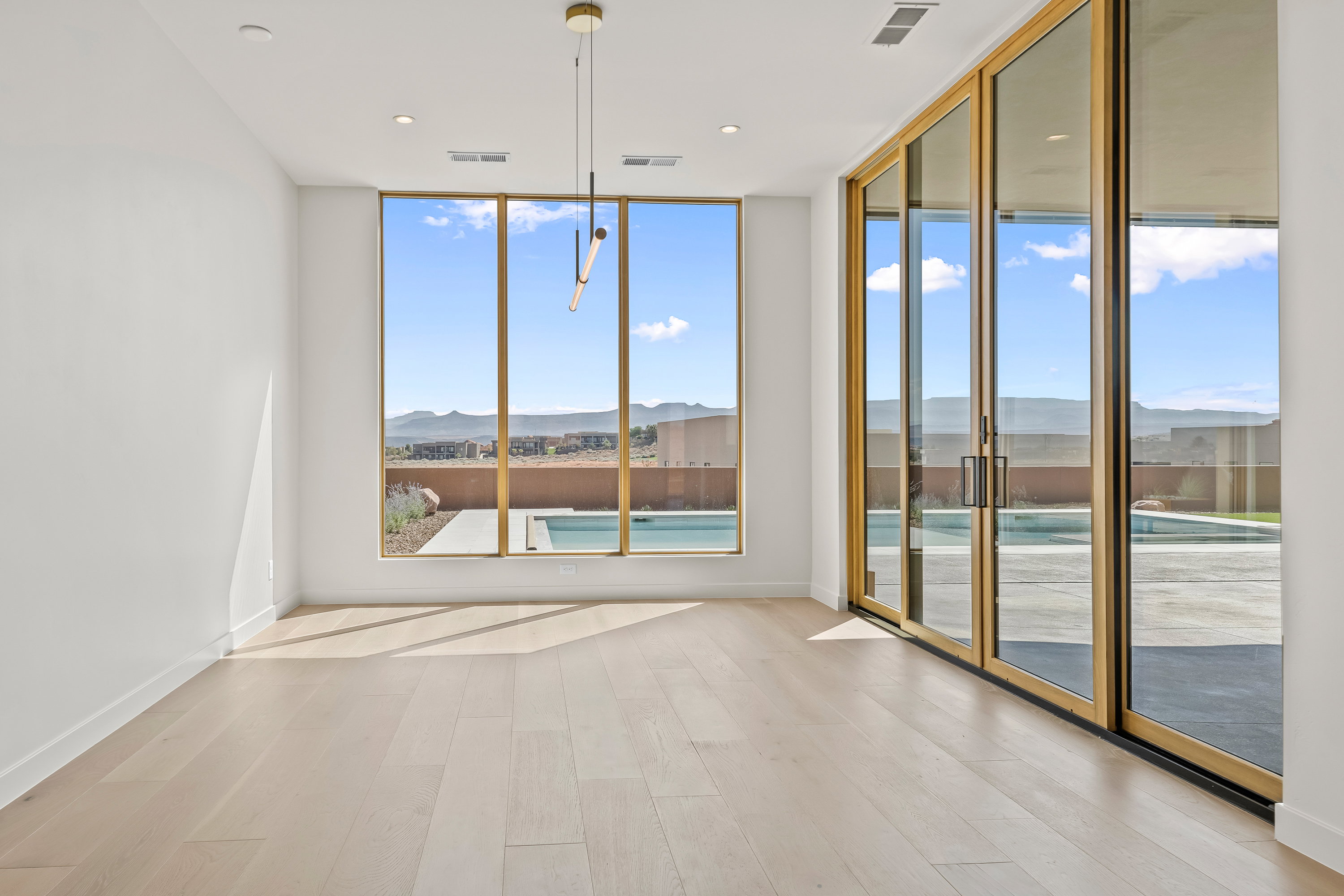 Dining Area with Large Windows and Sliders