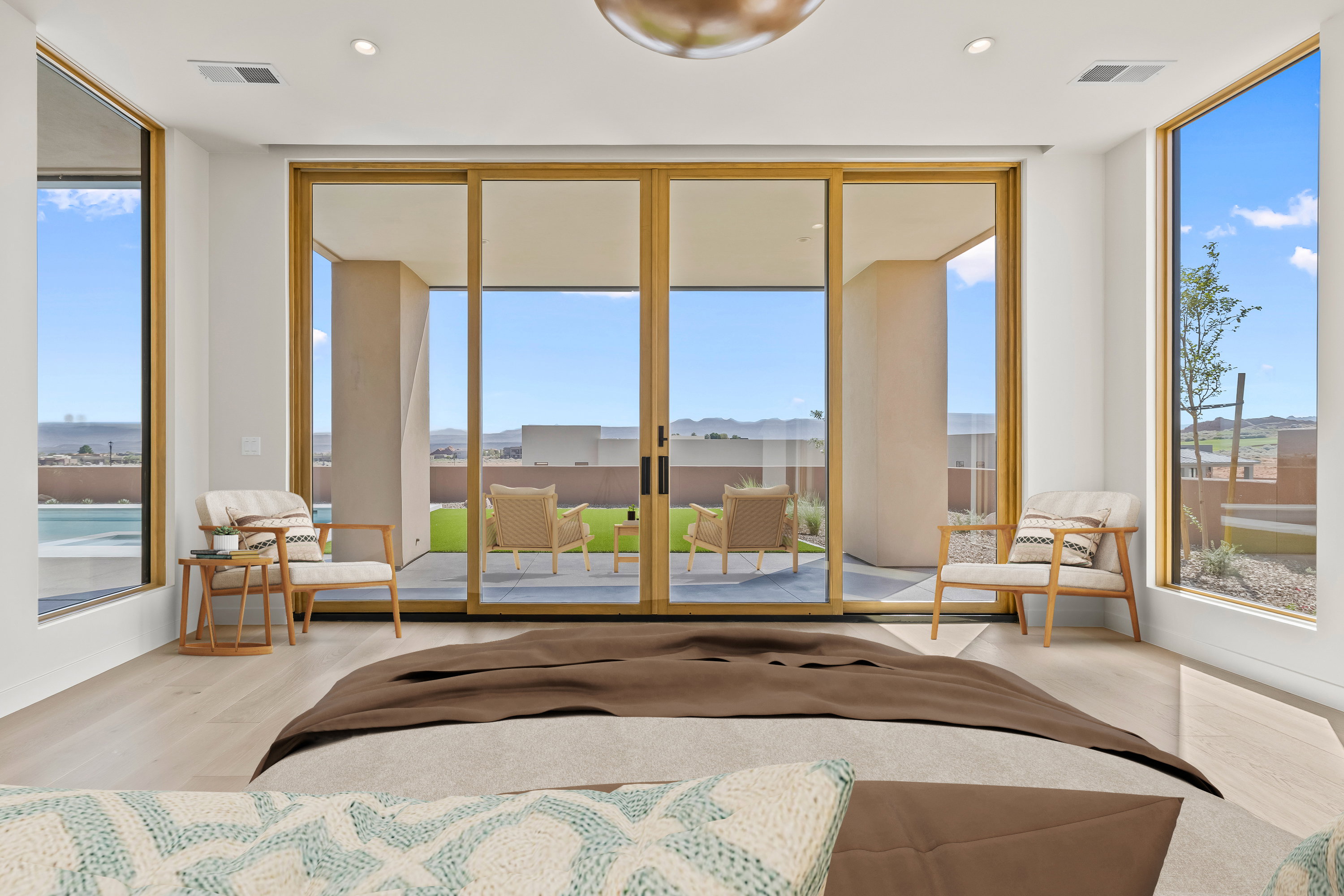 Large Primary Suite with a Large Slider and Windows to Capture all the Views