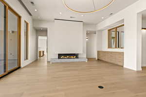 Custom 3-Sided Gas Fireplace with Textured Plaster Surround, and Custom Slab Hearth