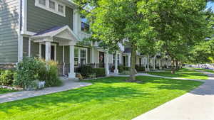 View of side of home featuring a lawn