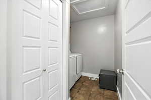 Laundry area with attic access and washing machine and dryer