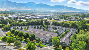 Aerial view of residential area featuring a mountain backdrop