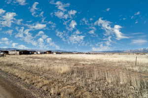 View of undeveloped land with mountains and rural landscape